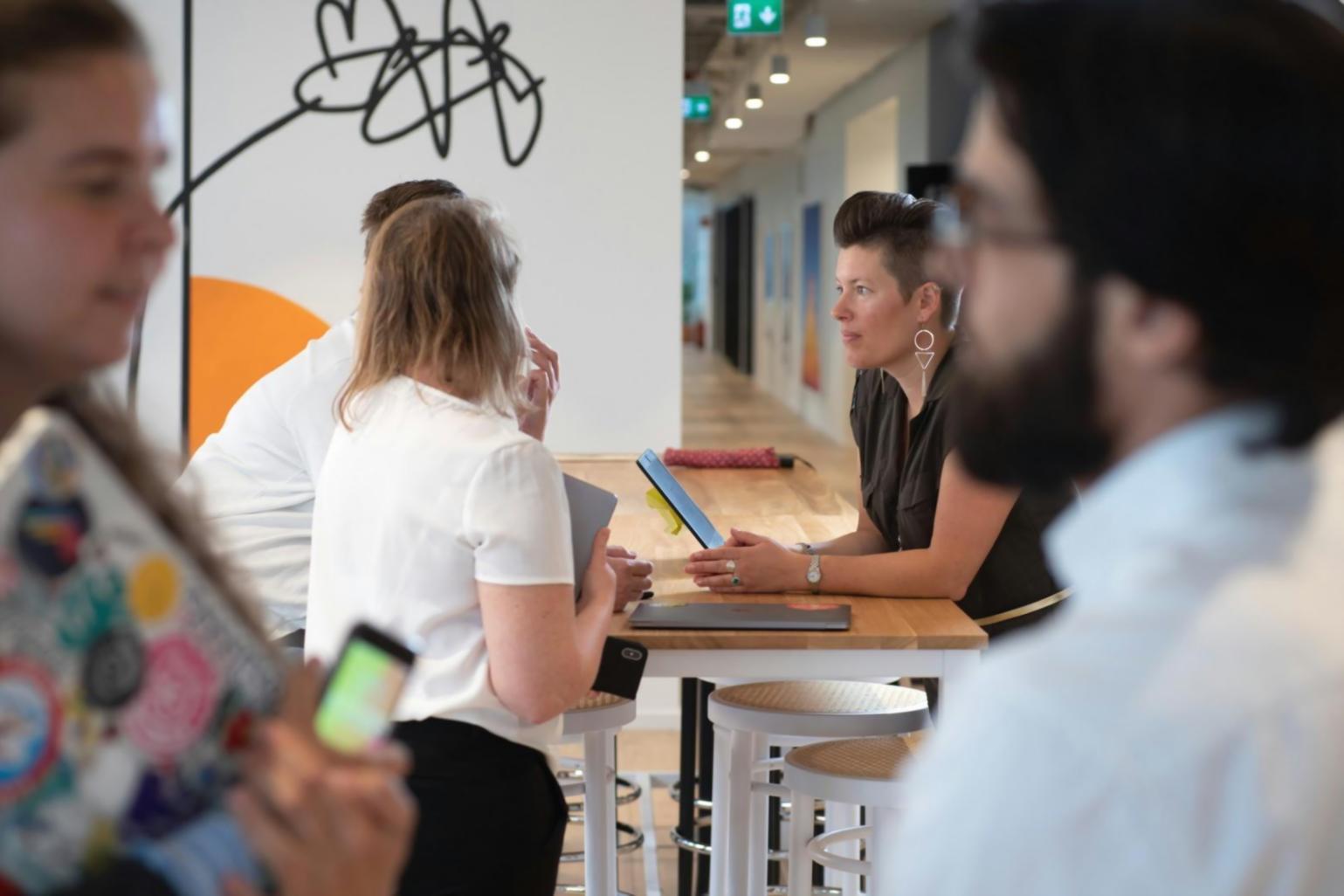 Financial planning workshop session with participants reviewing budget strategies